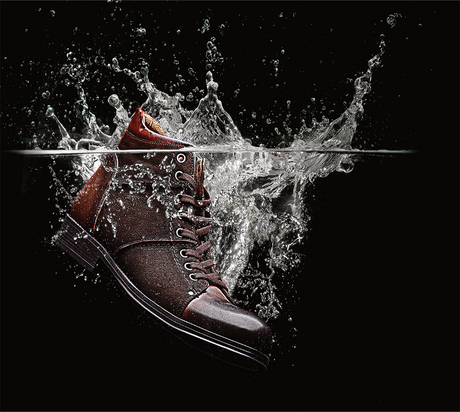Leather boot in a splash of water